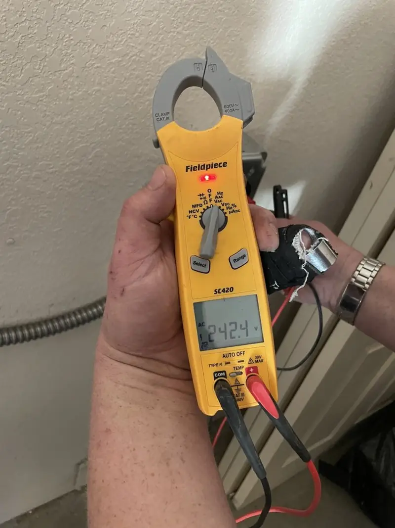 Voltage testing with clamp meter during Electrical Installation Services in Tinley Park